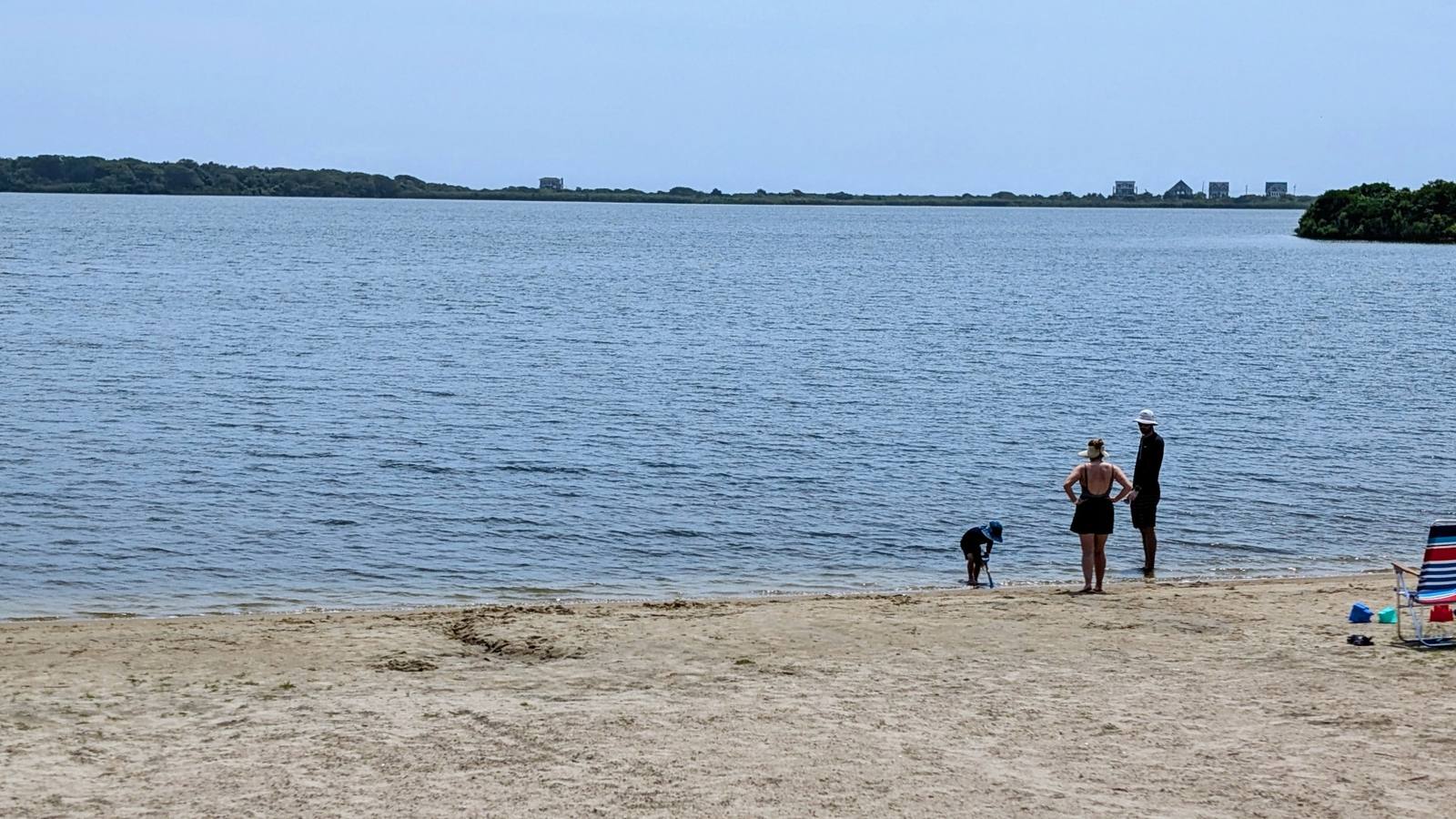 Family playing at the water
